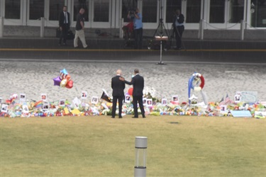 President Obama and Vice President Biden visiting the public memorial downtown