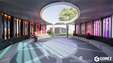 The healing garden. circular memorial pavilion with curved seating, perforated metal ceiling, and colorful vertical glass panels casting multicolored light onto the floor. Several people sit or walk through the open-air space, which has a large circular skylight above.